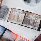 Collage of architectural drawings and photographs on a white surface