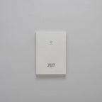 2027 Mini Planner A6 by Take a Note — compact white cover with gold-foil 2027 and logo, for journaling & planning