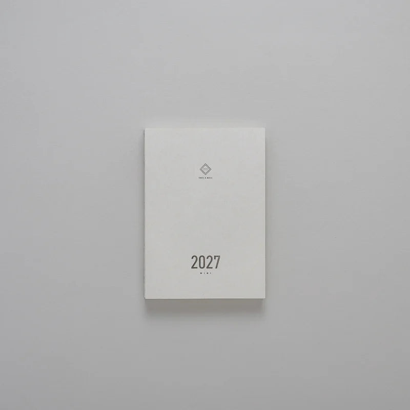 2027 Mini Planner A6 by Take a Note — compact white cover with gold-foil 2027 and logo, for journaling & planning