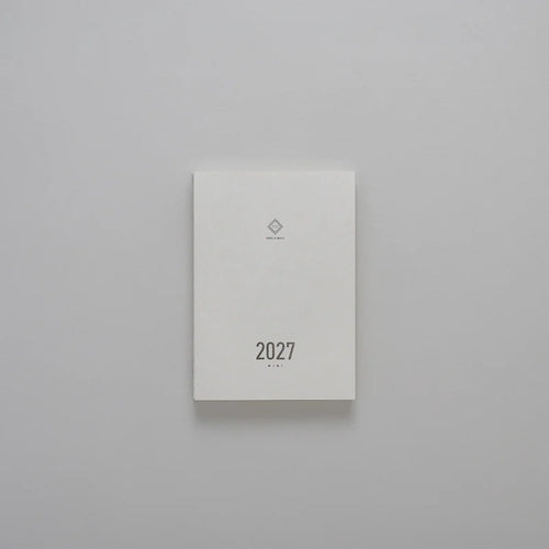 2027 Mini Planner A6 by Take a Note — compact white cover with gold-foil 2027 and logo, for journaling & planning