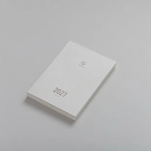 2027 Mini Planner A6 by Take a Note — compact white planner shown at an angle, for planning