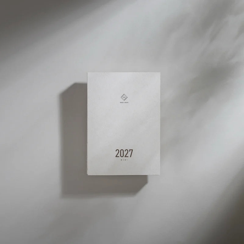 2027 Mini Planner A6 by Take a Note — minimalist white cover with gold-foil 2027, for journaling & planning