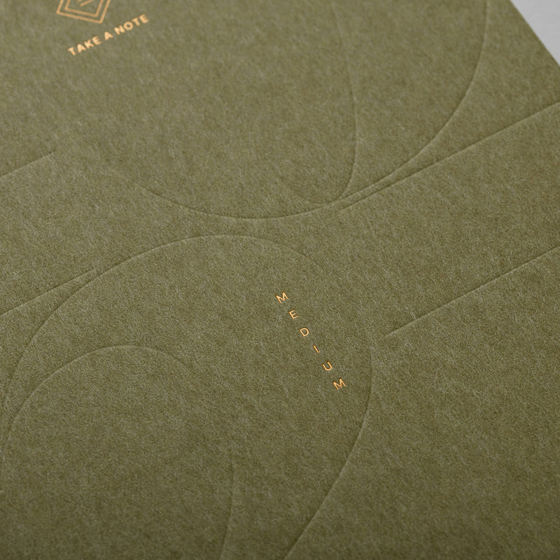 2027 Medium Weeks Planner B6 by Take a Note — olive textured cover detail with gold-foil logo, for journaling