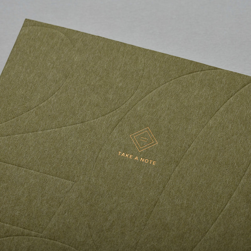2027 Medium Weeks Planner B6 by Take a Note — olive cover close-up with embossed lines and logo, for journaling