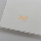 2027 Regular Planner A5 by Take a Note — cover detail with gold-foil 2027 and Regular, for planning
