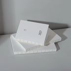 2027 Mini Planner A6 by Take a Note — stacked white planners with gold-foil 2027, for planning