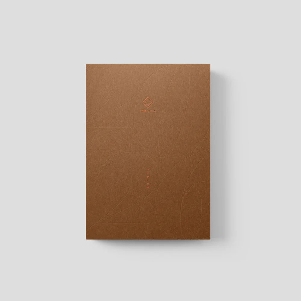 Brown notebook on a light gray background