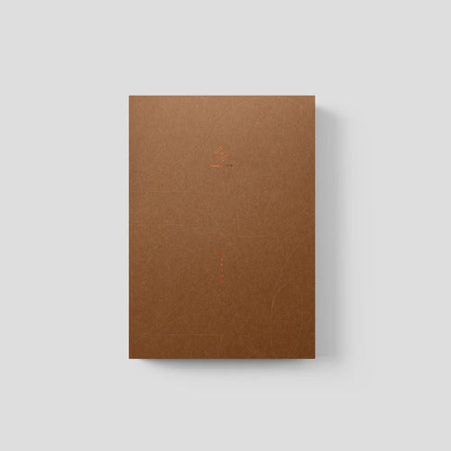 Brown notebook on a light gray background