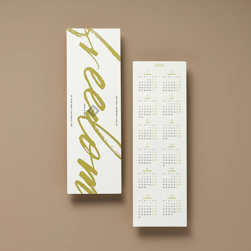 Two vertical calendar cards with gold text on a brown background