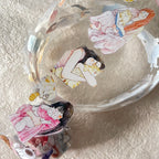 Set of illustrated stickers featuring women in various poses on a textured surface.