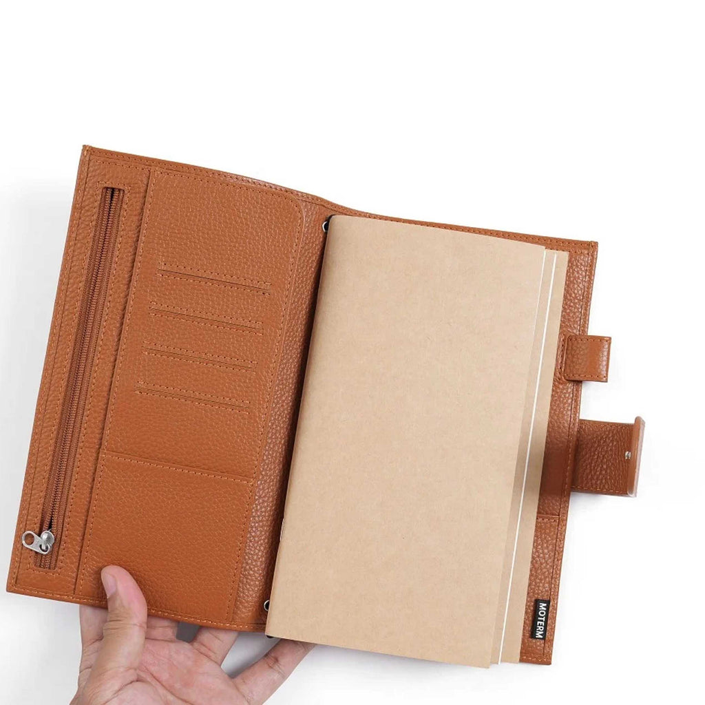 Companion Traveler Notebook Cover Standard by Moterm — pebbled-leather cover held open showing insert, for journaling