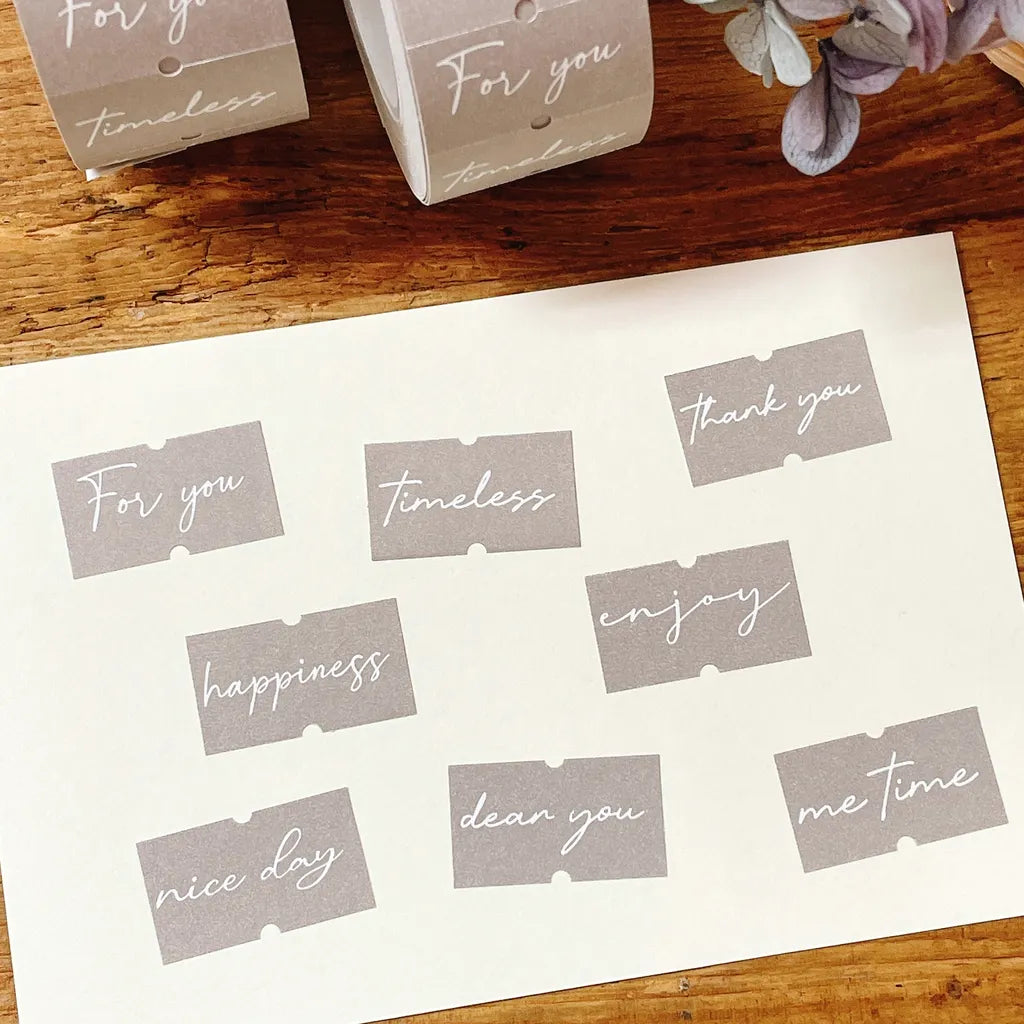 Sheet of Heart Words Label Sticker Tape cut-out phrases on a wooden surface with deco pieces