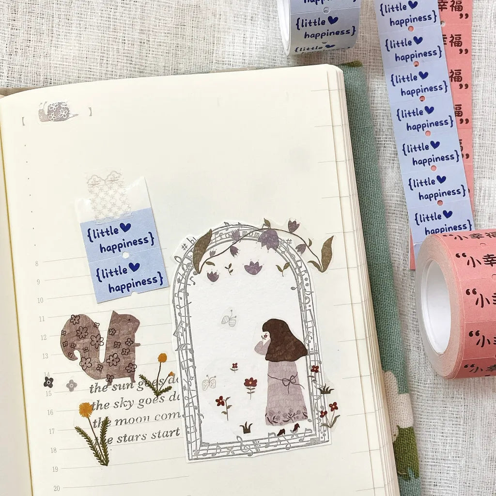 Little Happiness Label Sticker Tape illustrations and text applied along a notebook page