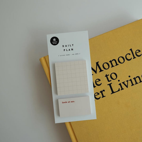 Daily Plan.18 memo pad by Suatelier, grid pages in packaging on a yellow book