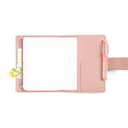 Elite Planner Cover A6 by Moterm — pink pebbled-leather cover open with pen and floral tag, for journaling