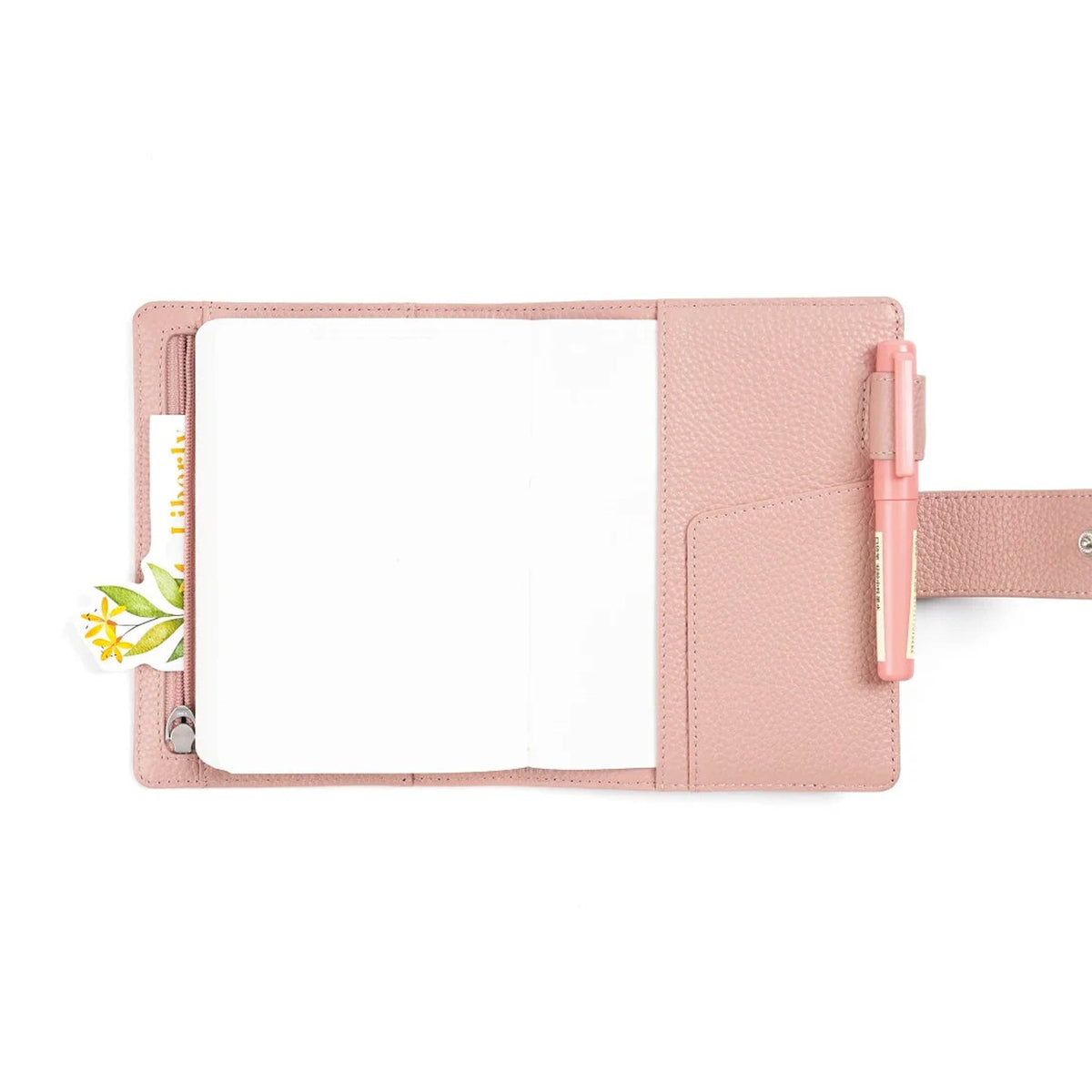 Elite Planner Cover A6 by Moterm — pink pebbled-leather cover open with pen and floral tag, for journaling