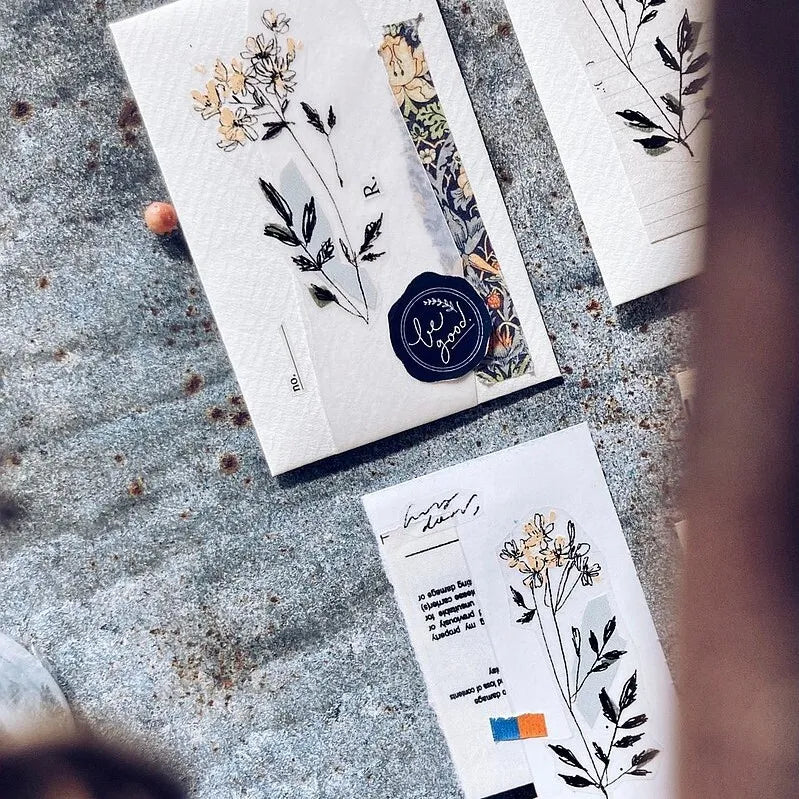 Floral design cards on a textured surface