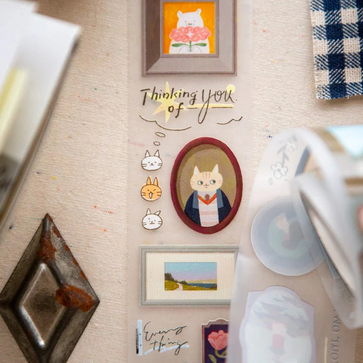 Decorative elements with cat illustrations and 'Thinking of You' text on a textured surface.