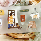 Set of illustrated stickers featuring a woman, dog, and book store theme on a clear background.