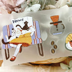 Set of cute illustrated stickers featuring a cat, coffee cup, and other elements on a clear background.