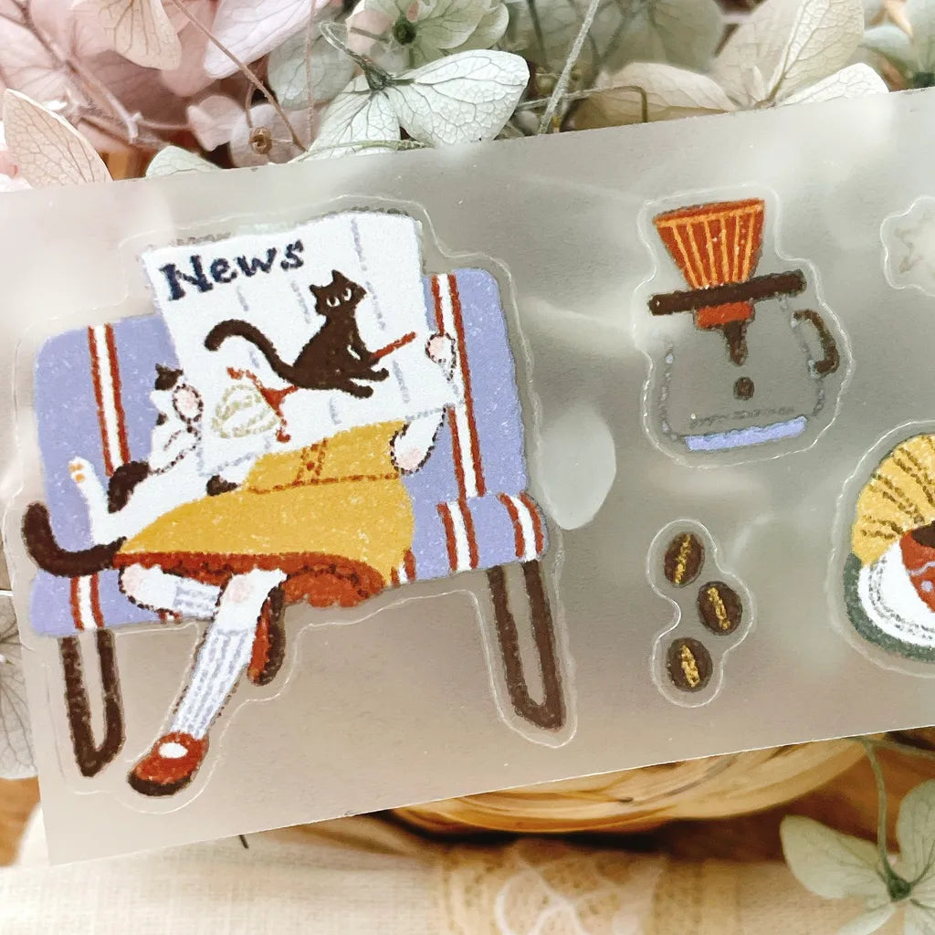 A Moving Day Crystal PET Tape cute cat and coffee cup stickers on a clear backing sheet
