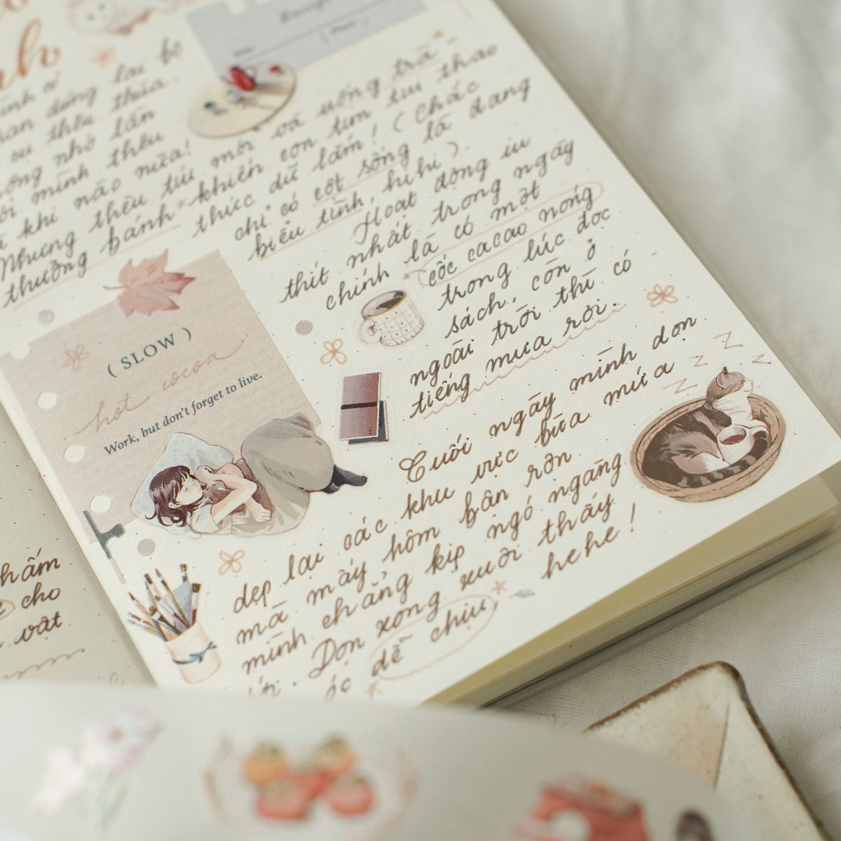 Notebook decorated with Aki No Heya PET Tape stickers and text on a light background