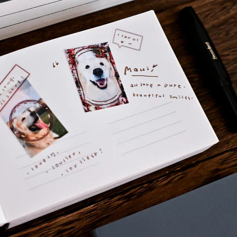 Anytime Anywhere Journal spread featuring dog photos and journaling text, overhead view on a wooden surface