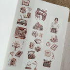 Sheet of illustrated stickers featuring various objects and a person on a white background.