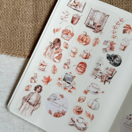 Autumn Is Here PET Tape designs with pumpkins, leaves and cozy figures on a textured surface