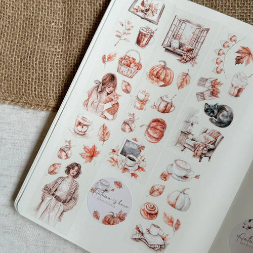 Sheet of autumn-themed stickers with pumpkins, leaves, and people on a textured surface.