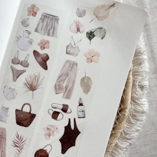 Boho Summer PET Tape sticker sheet with dresses, sun hats and bags displayed on a textured surface