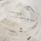 Marble surface with motivational quote and abstract designs