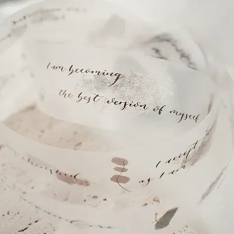 Attic Calligraphy Spiritual Quote PET Tape lettering with abstract designs styled on a marble surface