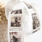 Roll of decorative paper with black and white images on a white background