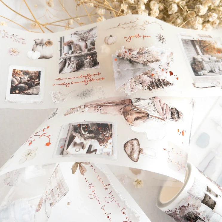 Decorative paper with floral and text designs on a white surface.