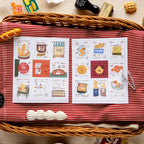 Illustrated menu on a red and white striped tablecloth with wicker basket and decorative items.