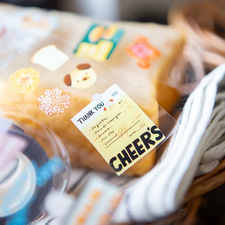 Bakery Cheer's PET Tape Cheers label styled on a colorful snack package, close-up