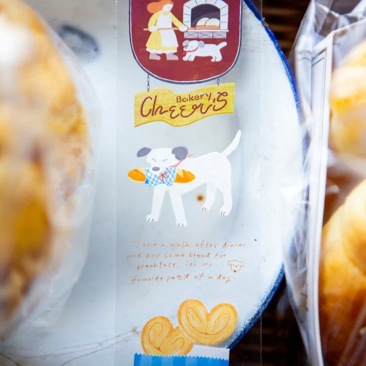Bakery Cheer's PET Tape cartoon dog design styled on packaged cookies, detail view