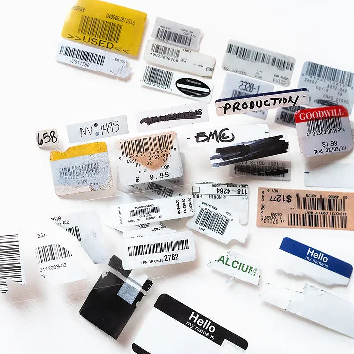 Mix of vintage product tags and barcode labels from the Barcode Vintage PET Tape on a white surface