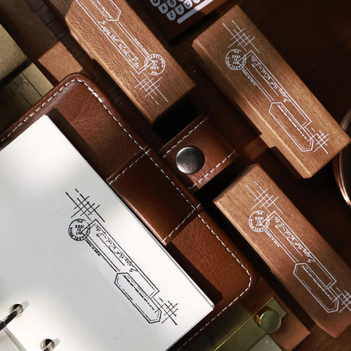 Close-up of a leather wallet with wooden card holders and metal buttons.