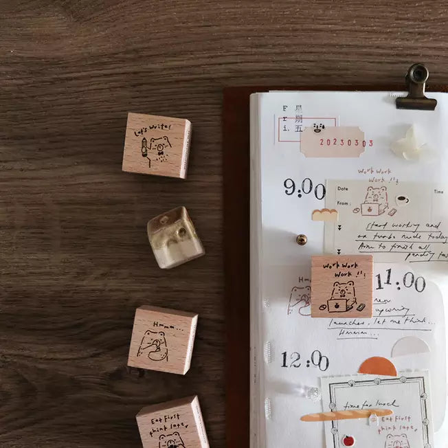 Beary Ordinary Days 01 stamps with cartoon bear designs beside a planner on a wooden desk