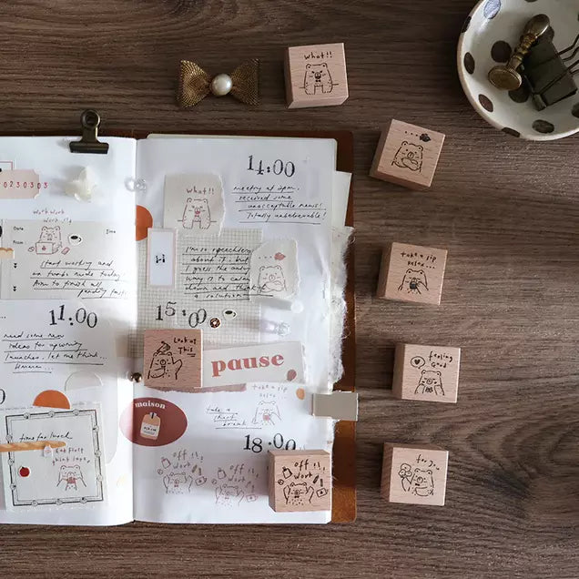 Open notebook styled with Beary Ordinary Days 01 stamps and prints on a wooden surface