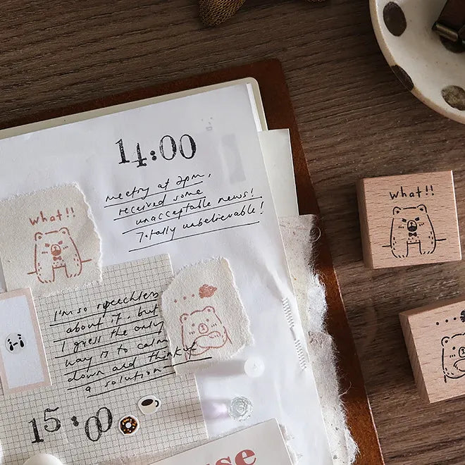 Notebook with handwritten text and rubber stamps on a wooden surface