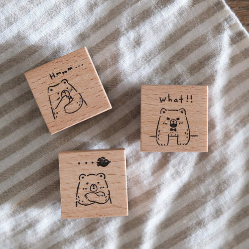 Three Beary Ordinary Days 01 wooden stamps with expressive bear faces on striped fabric