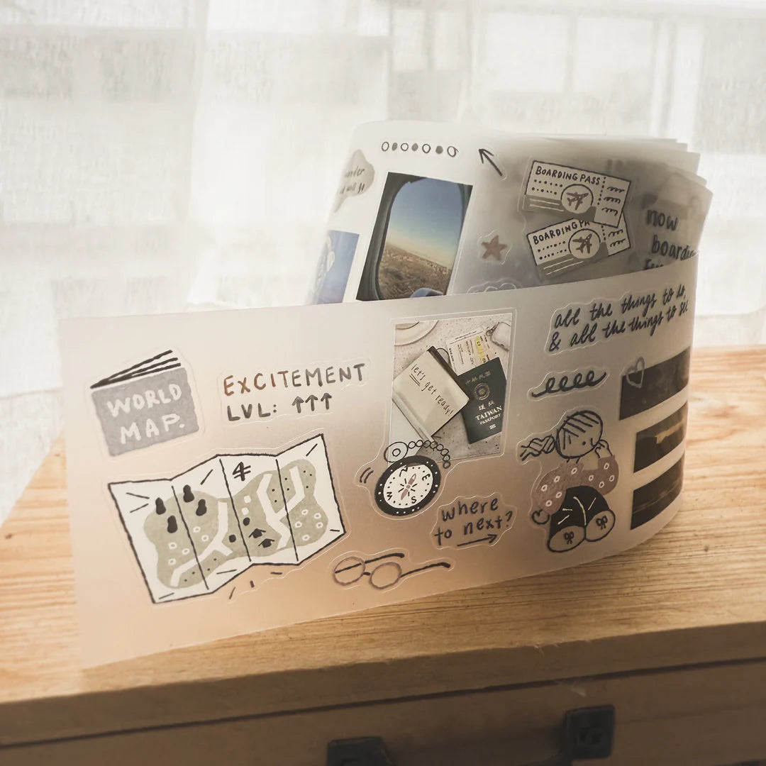 Storage bin decorated with Before Trip PET Tape travel illustrations on a wooden surface