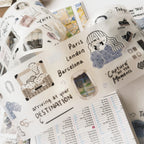 Decorative stickers with travel-themed designs on a planner page.