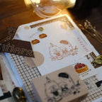 Set of rubber stamps with cartoon designs on a wooden surface