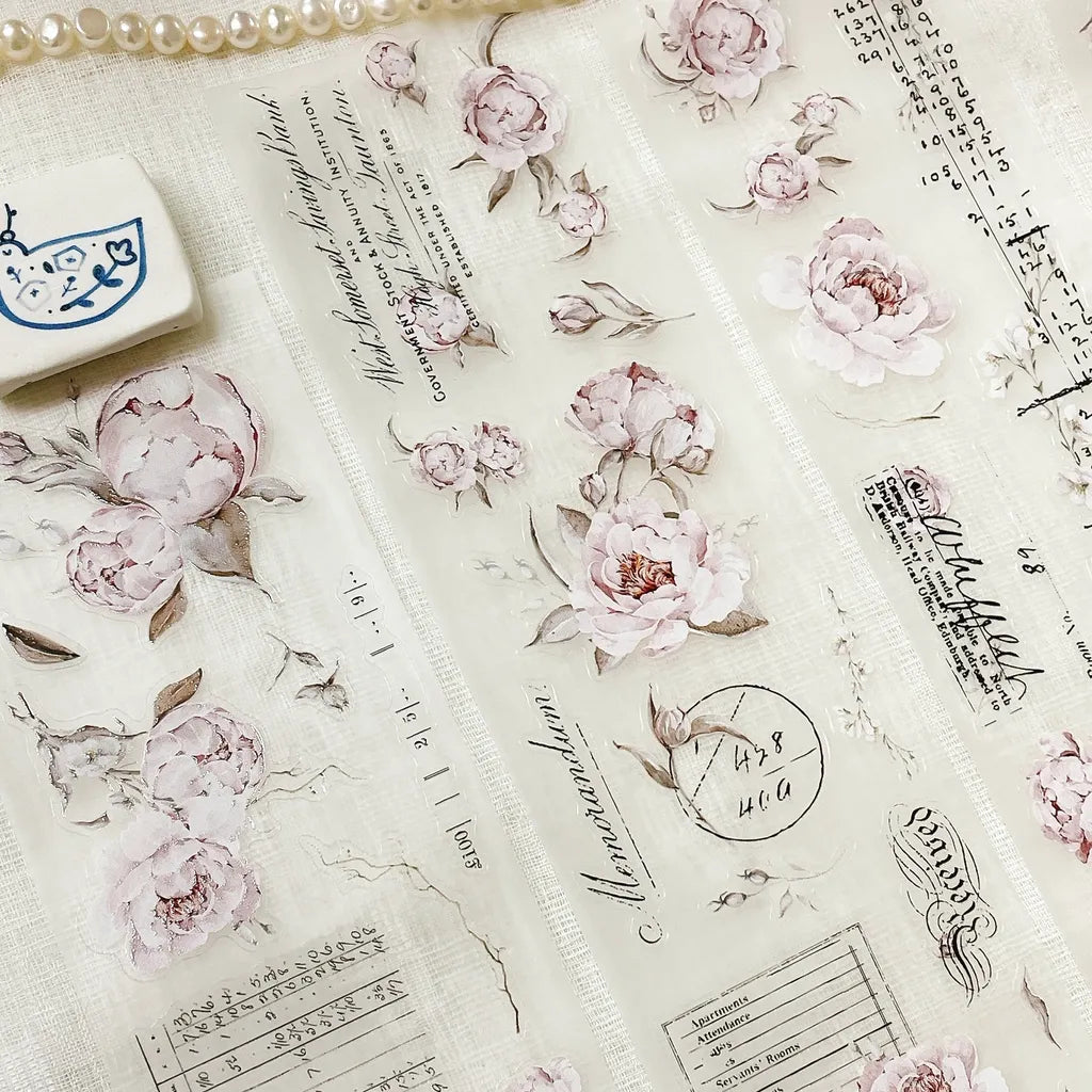 Blooming Archive PET Tape sheet of pink floral and text designs on a textured background