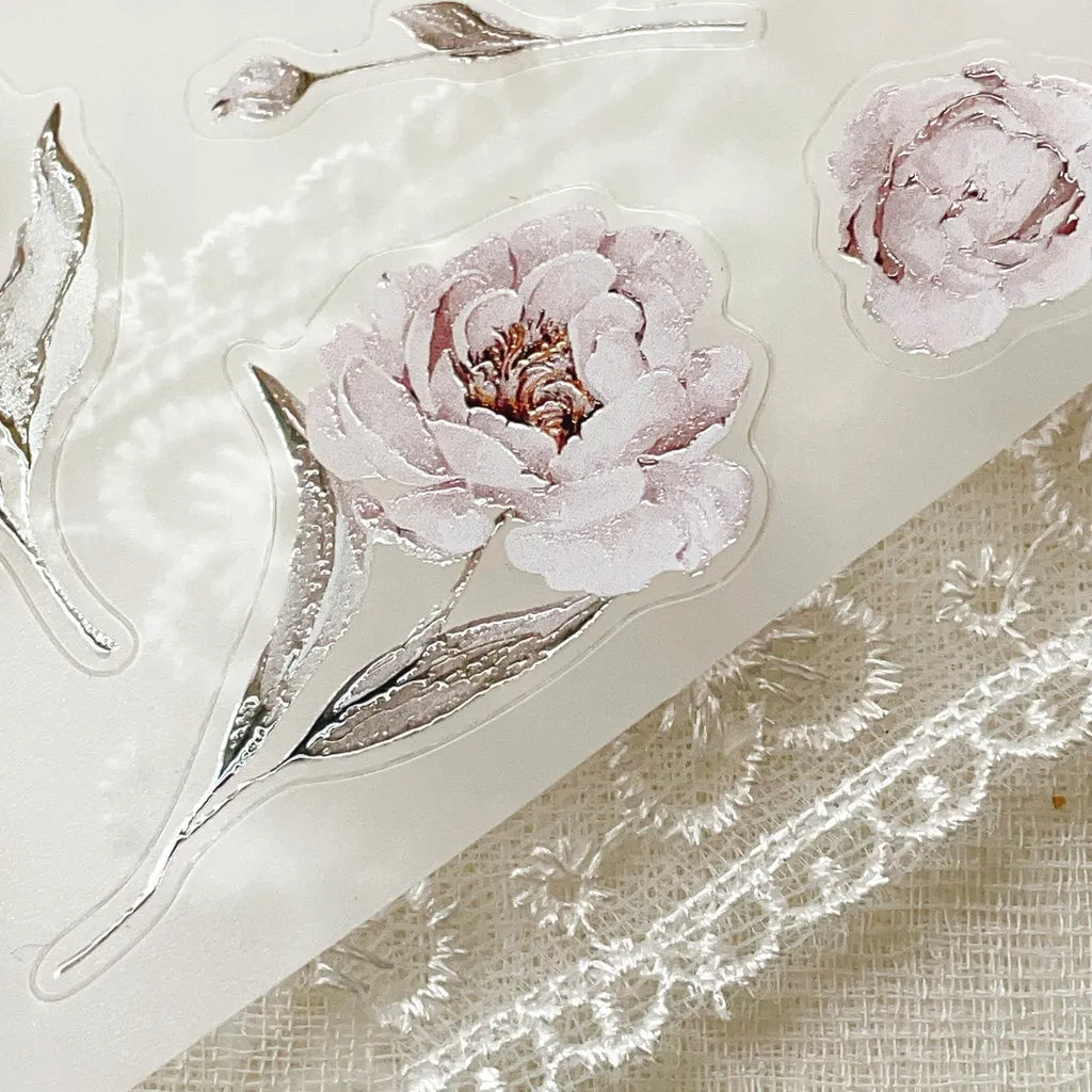 Blooming Archive PET Tape pink flower and green leaf stickers on a textured beige backdrop
