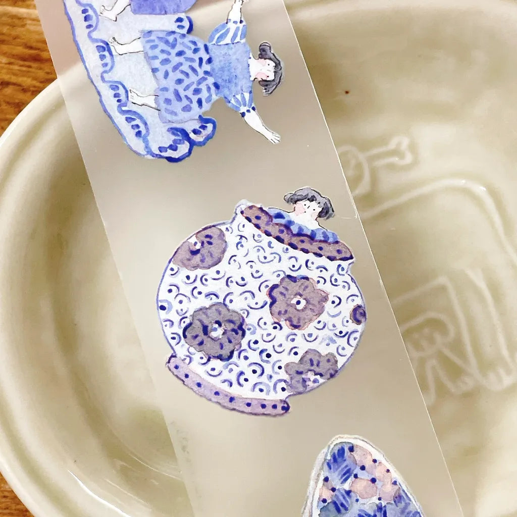 Close-up of Blue And White PET Tape watercolor girls, teapots and cozy home designs